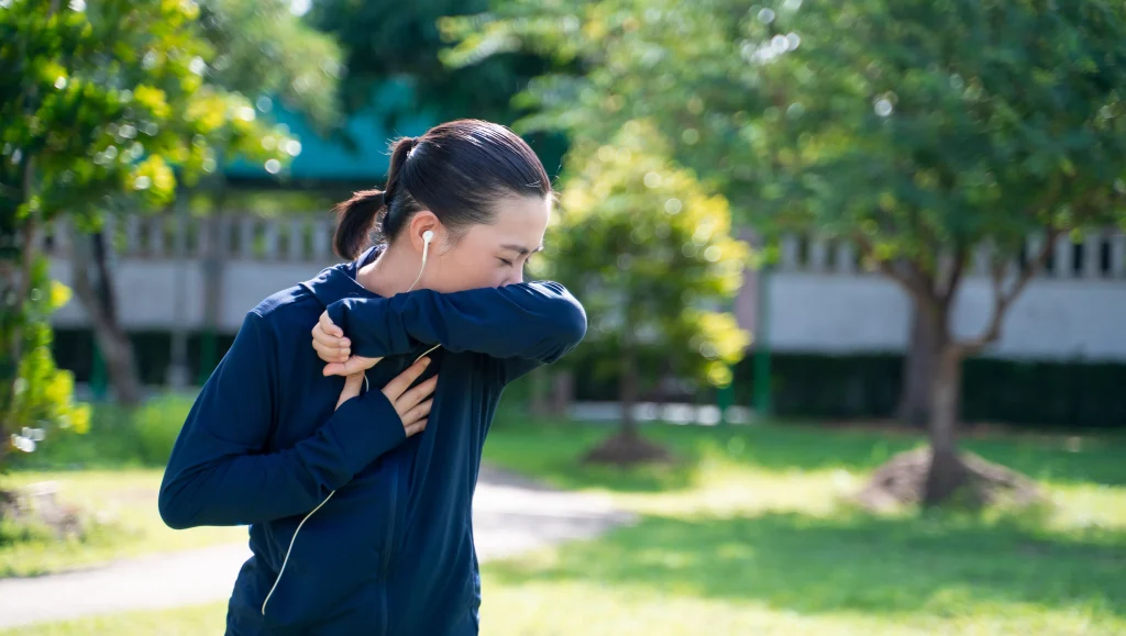 Woman coughing sick while running
